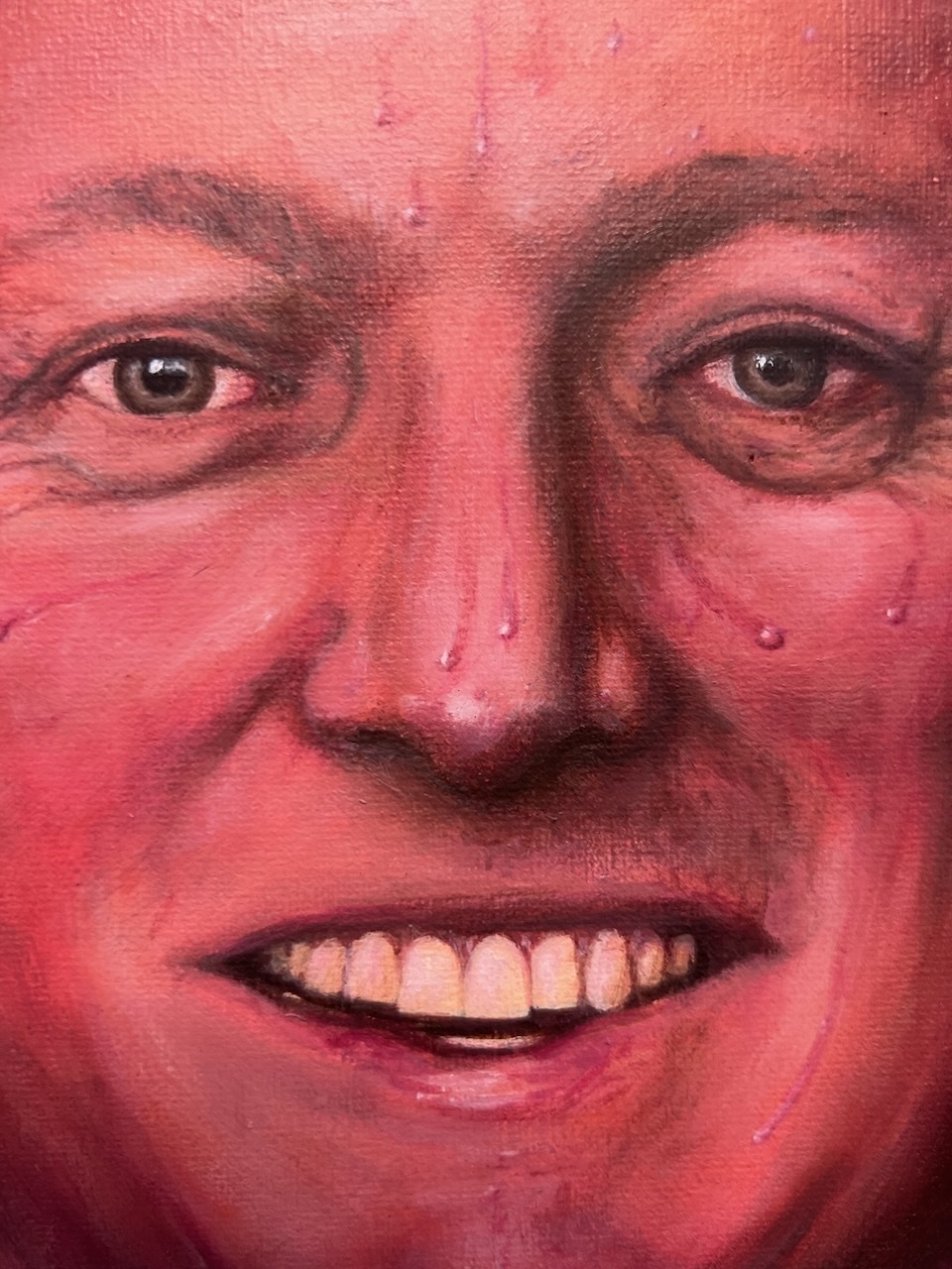 A close-up, painted portrait of the smiling face of Christopher Luxon with a red hue.